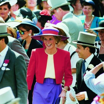 Princess Diana attends Ascot in purple and pink hat and pink blazer. Kent Gavin